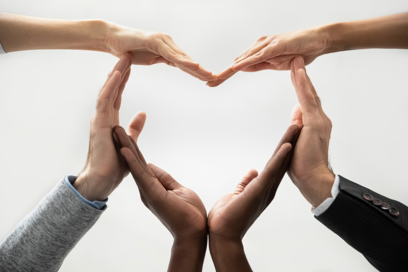 Many Hands Forming a Heart Shape
